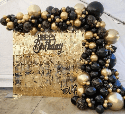 Gold shimmer wall w/ balloon garland