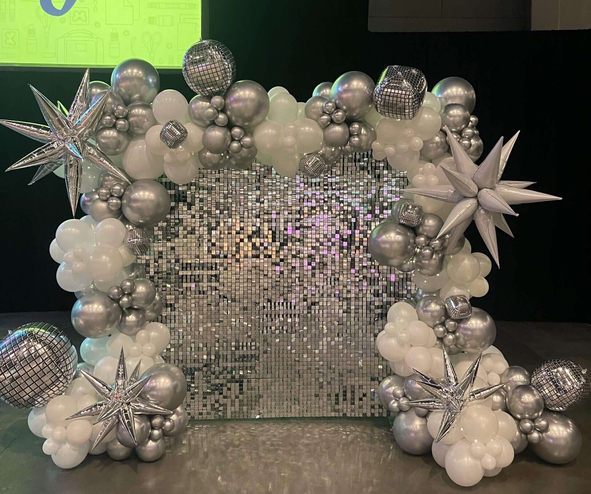 silver shimmer wall with balloon garland
