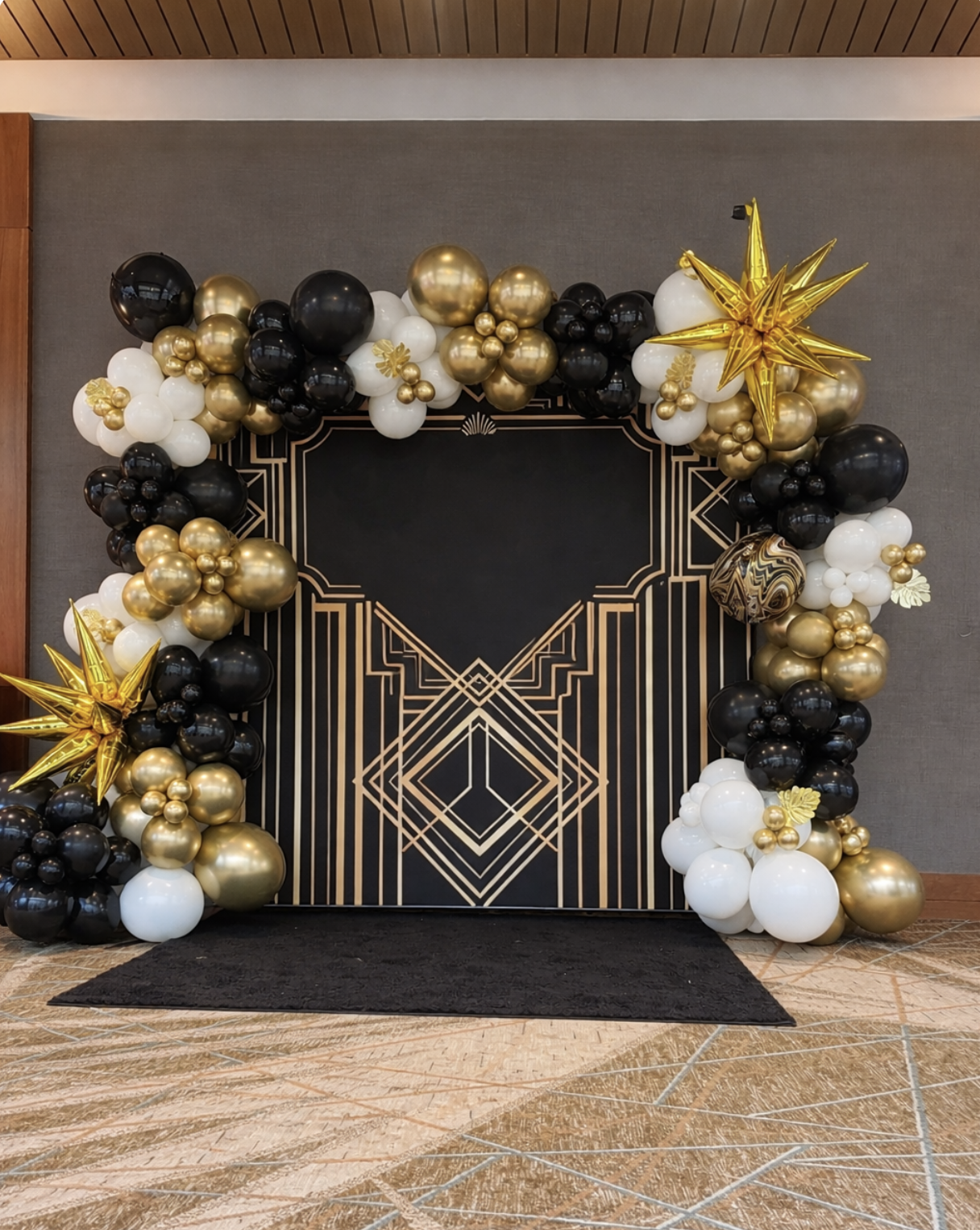 large balloon backdrop with balloon garland at crabtree Marriott raleigh nc