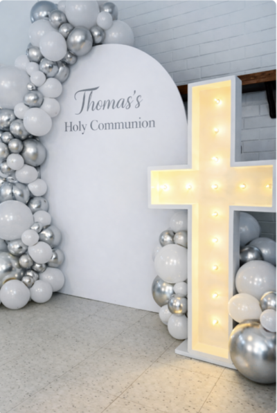 Holy communion balloon backdrop setup in Raleigh nc with a 4 foot marquee light up cross for rental in Raleigh Nc
